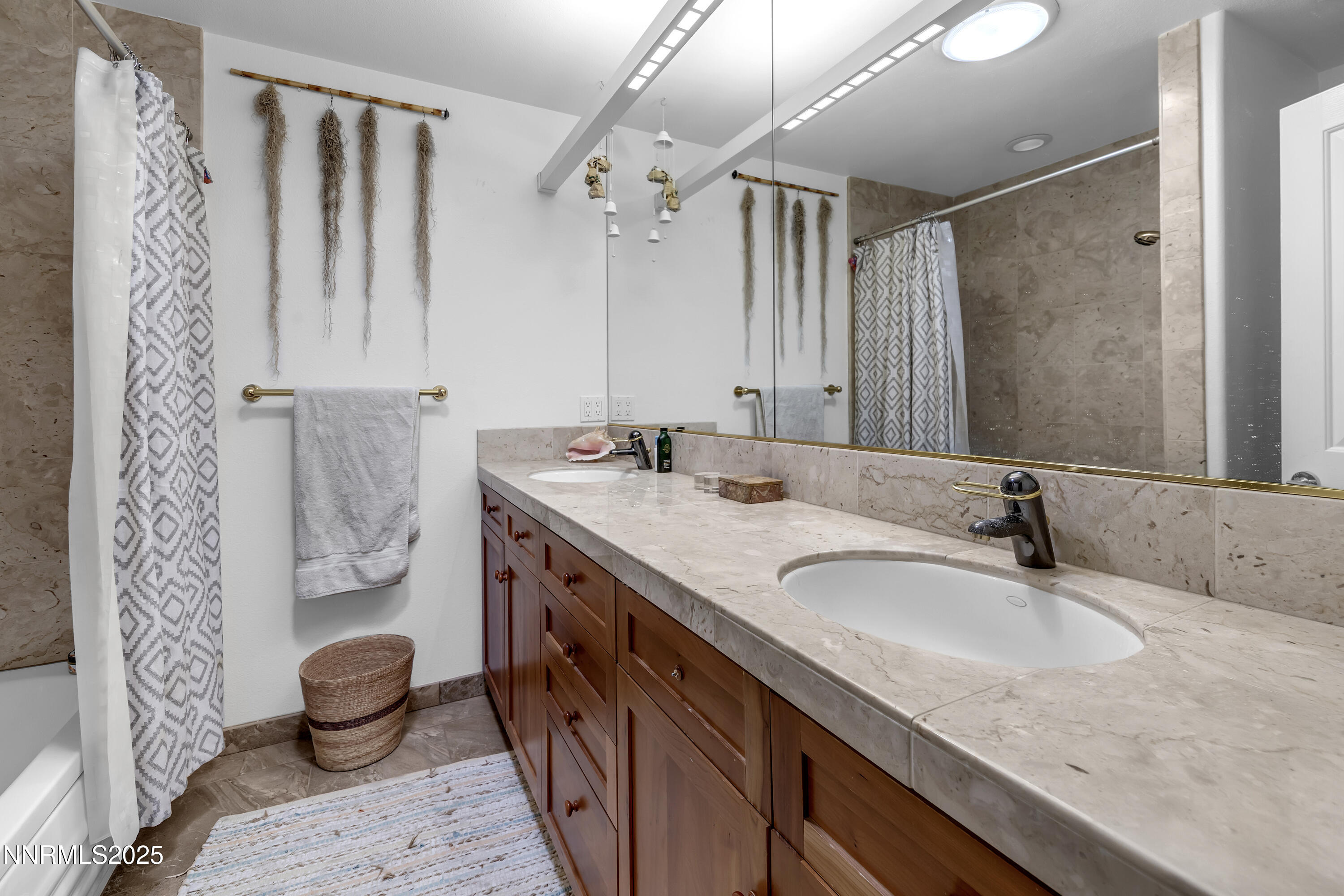 512 Island Avenue Reno, NV 89501 - Photo 28 of 30 a bathroom with a granite countertop sink and a mirror