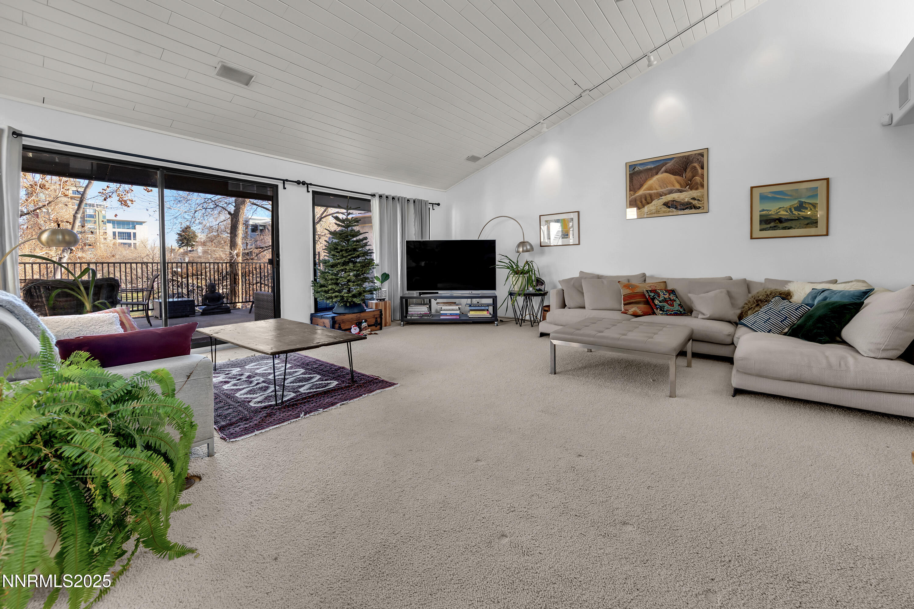 512 Island Avenue Reno, NV 89501 - Photo 9 of 30 a living room with furniture and a flat screen tv