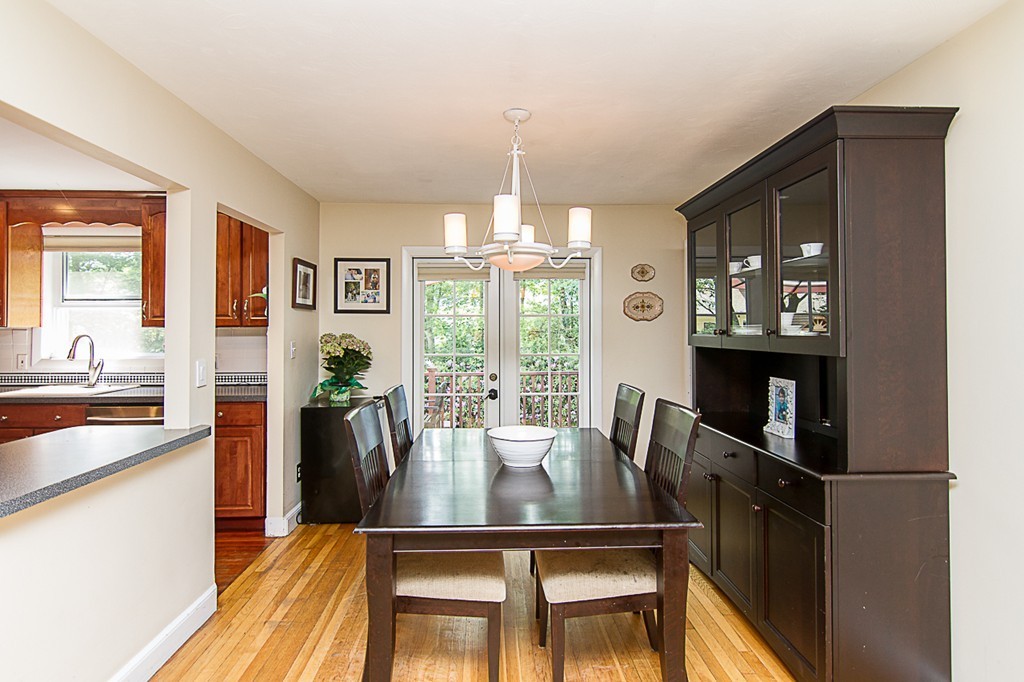 88 Selwyn Road Newton, MA 02461 - Photo 12 of 26 a dining room with furniture a chandelier and wooden floor