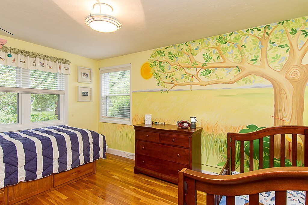 88 Selwyn Road Newton, MA 02461 - Photo 20 of 26 a bedroom with a bed and wooden floor