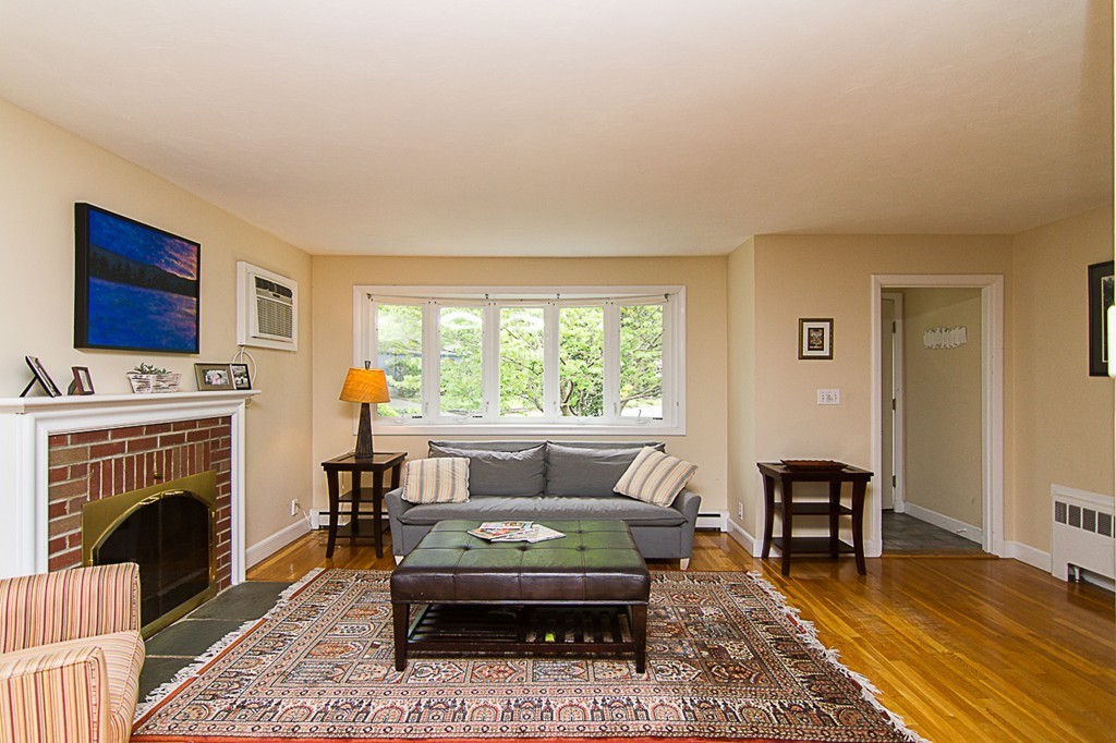 88 Selwyn Road Newton, MA 02461 - Photo 2 of 26 a living room with furniture and a fireplace