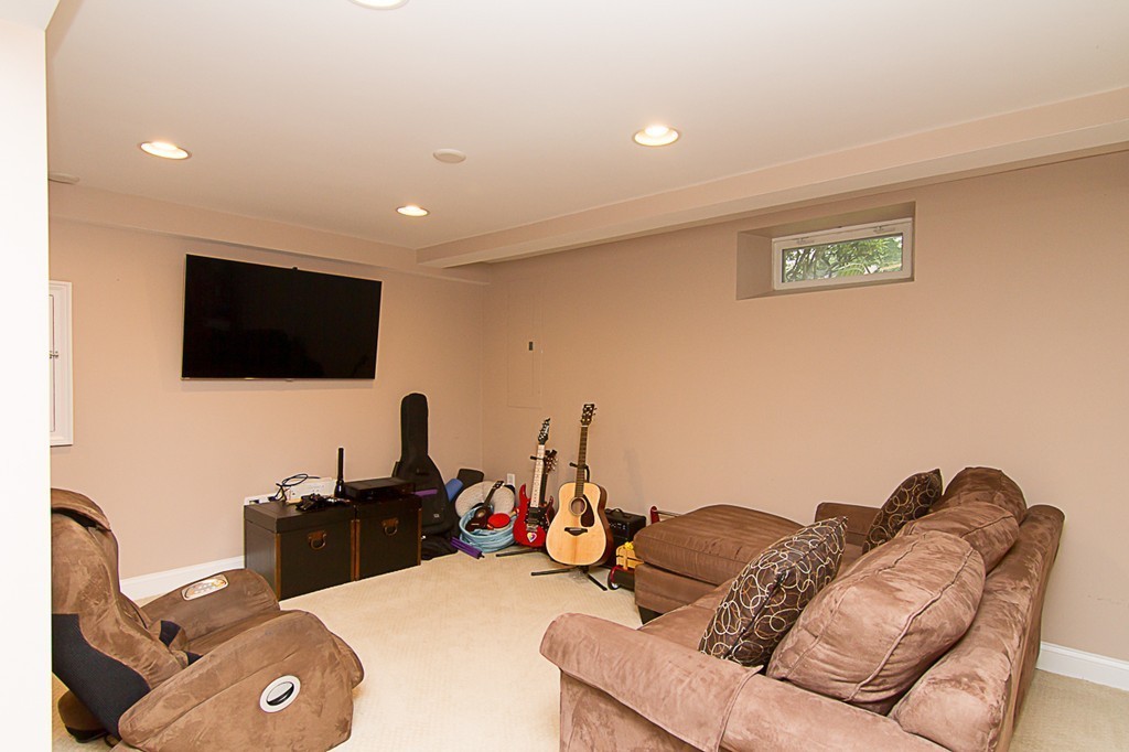 88 Selwyn Road Newton, MA 02461 - Photo 23 of 26 a living room with furniture and a flat screen tv
