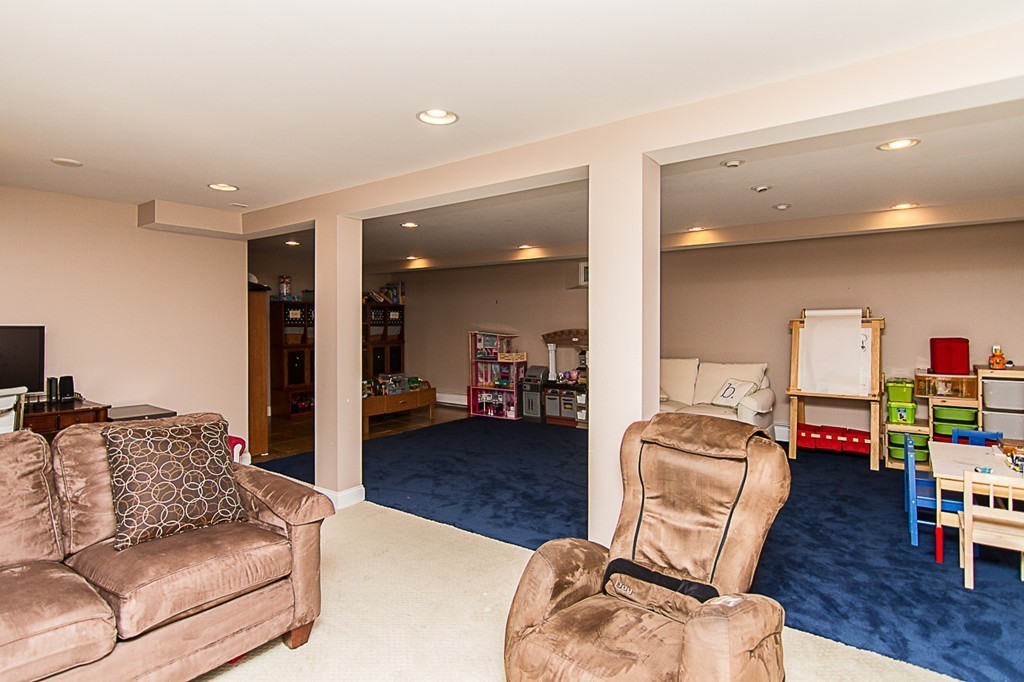 88 Selwyn Road Newton, MA 02461 - Photo 24 of 26 a living room with furniture and a wooden floor