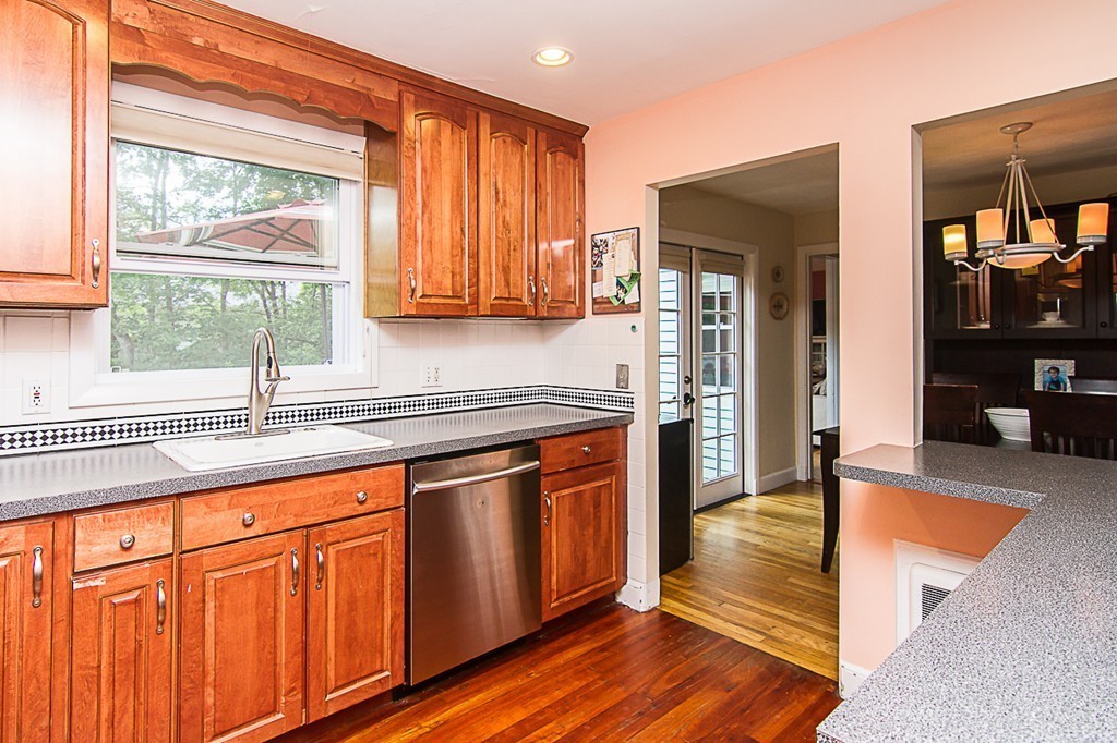 88 Selwyn Road Newton, MA 02461 - Photo 6 of 26 a kitchen with stainless steel appliances granite countertop cabinets and a counter top space
