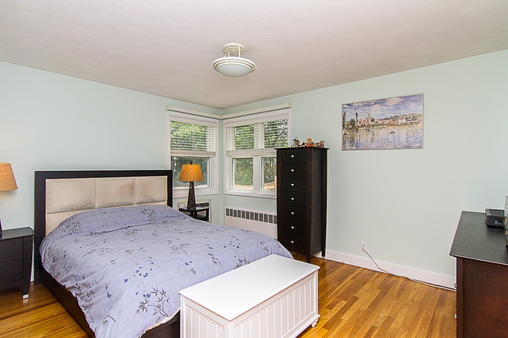 88 Selwyn Road Newton, MA 02461 - Photo 9 of 26 a bedroom with a bed and wooden floor