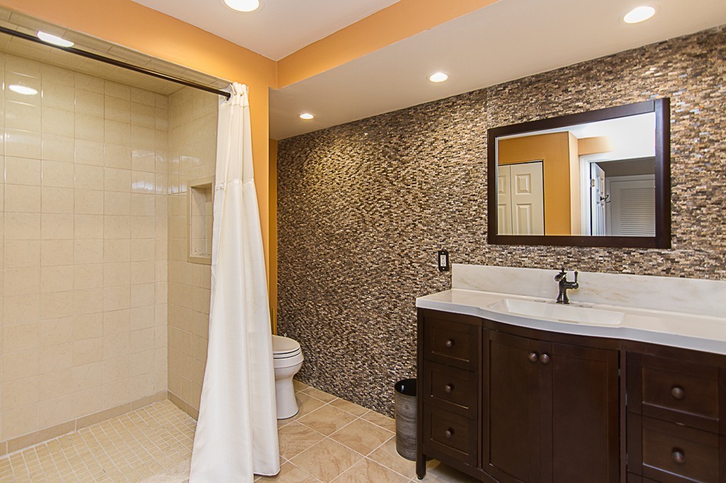 88 Selwyn Road Newton, MA 02461 - Photo 10 of 26 a bathroom with a double vanity sink mirror and toilet