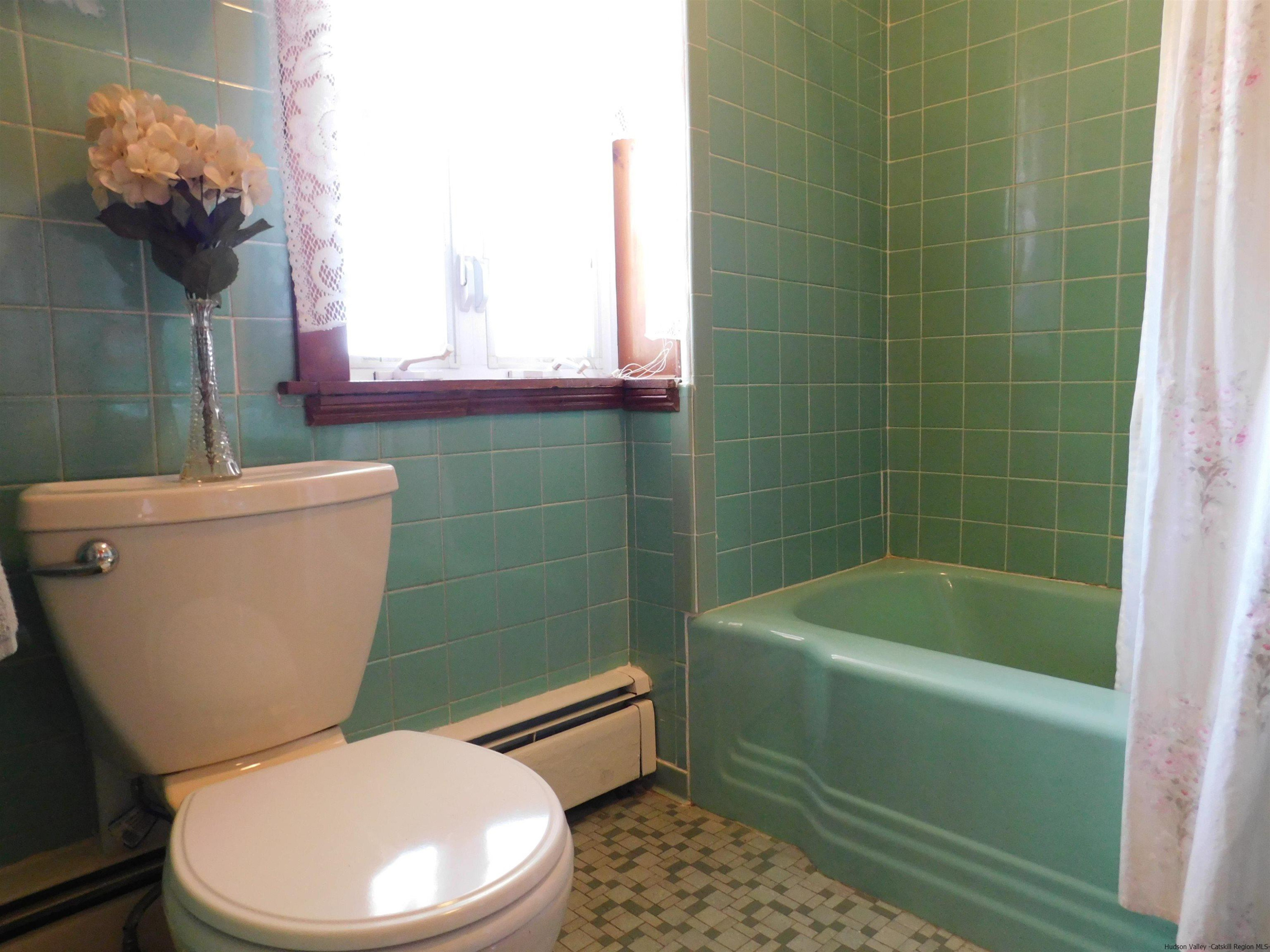 145 Sportsman Road Napanoch, NY 12458 - Photo 13 of 31 a white toilet sitting next to a bath tub