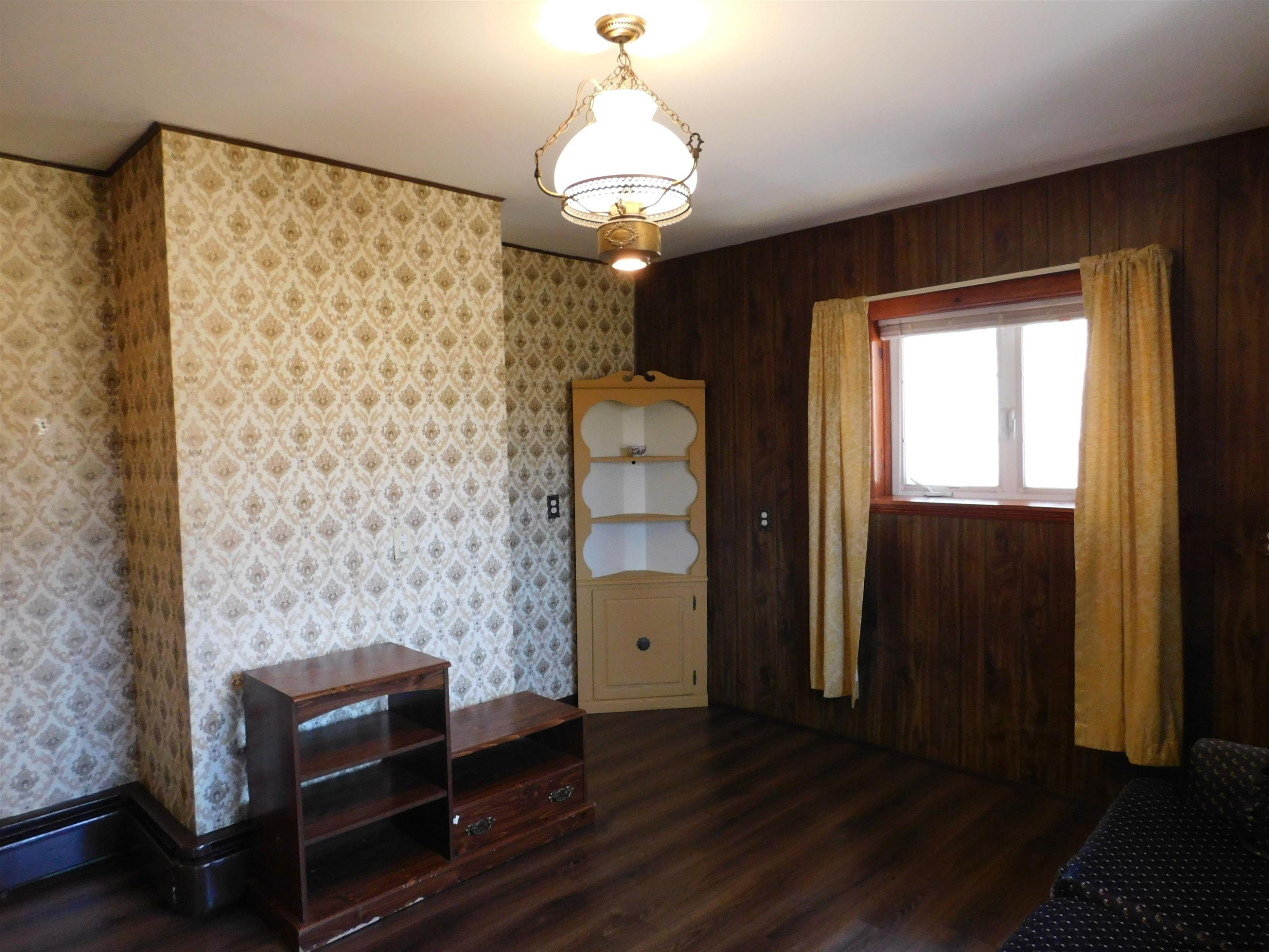 145 Sportsman Road Napanoch, NY 12458 - Photo 14 of 31 a living room with furniture and a chandelier