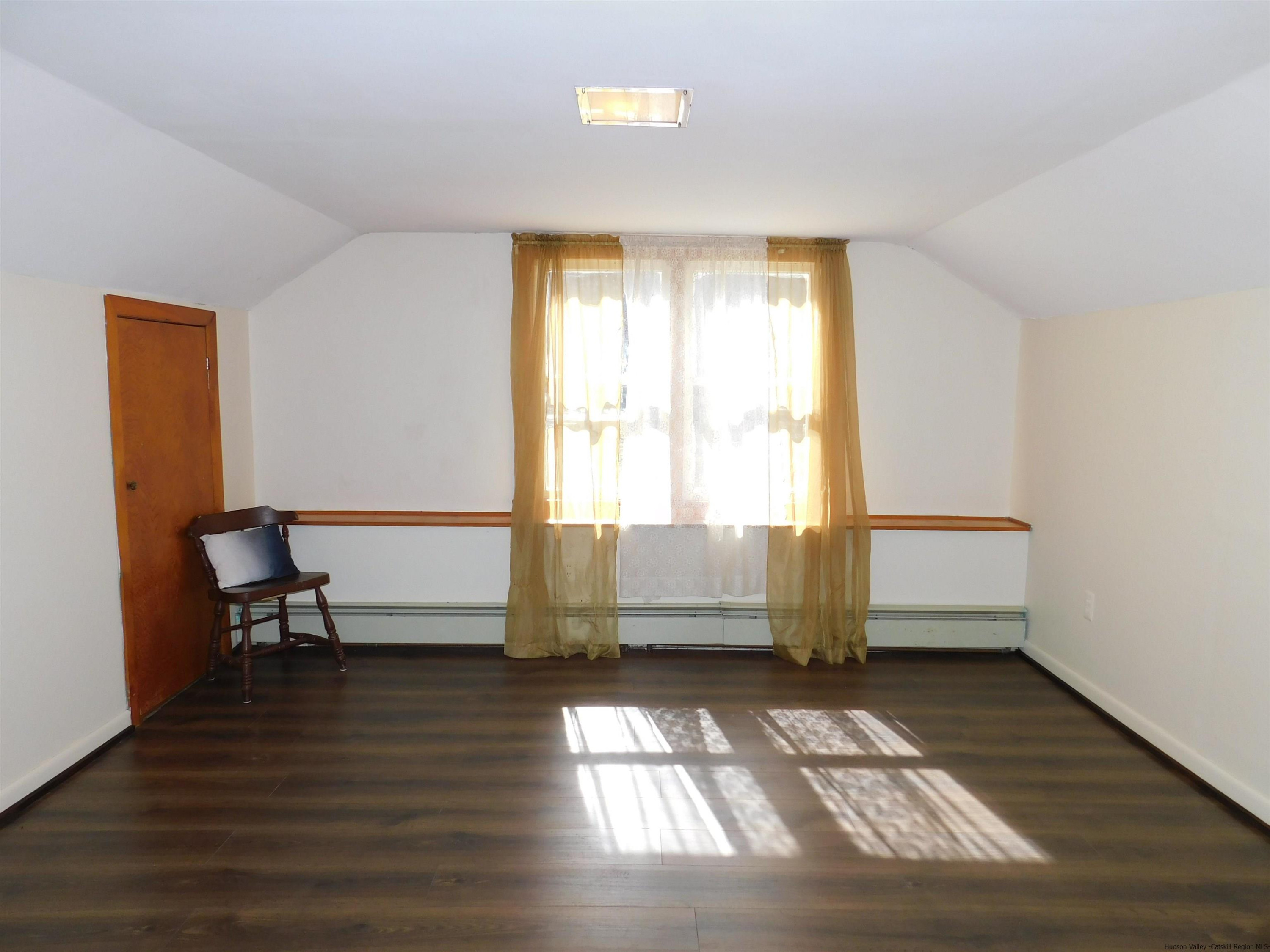 145 Sportsman Road Napanoch, NY 12458 - Photo 19 of 31 a view of a room with wooden floor and lounge chairs