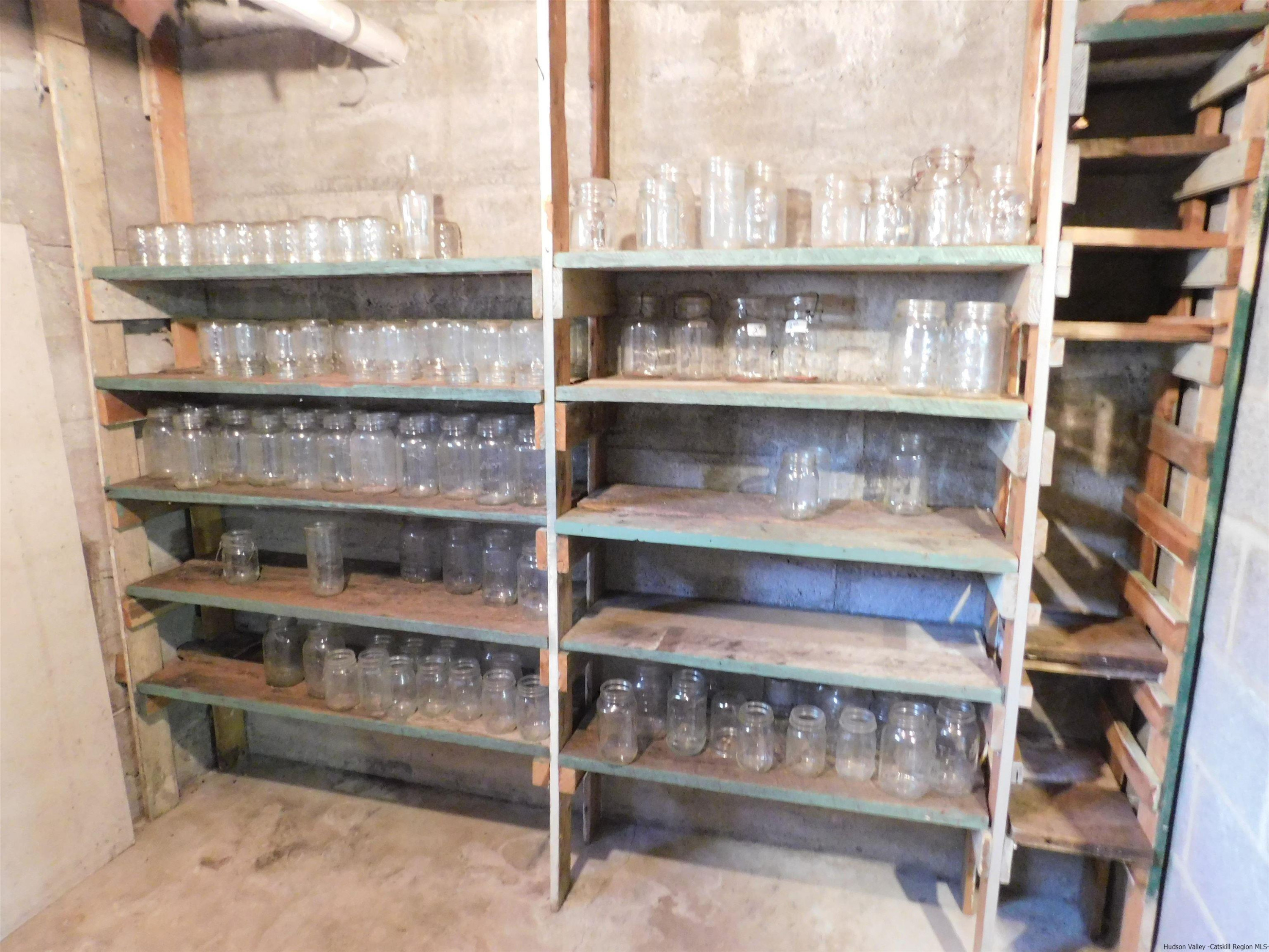 145 Sportsman Road Napanoch, NY 12458 - Photo 21 of 31 a shelf with glass windows and a table