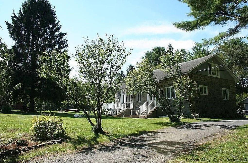 145 Sportsman Road Napanoch, NY 12458 - Photo 25 of 31 a front view of a house with garden