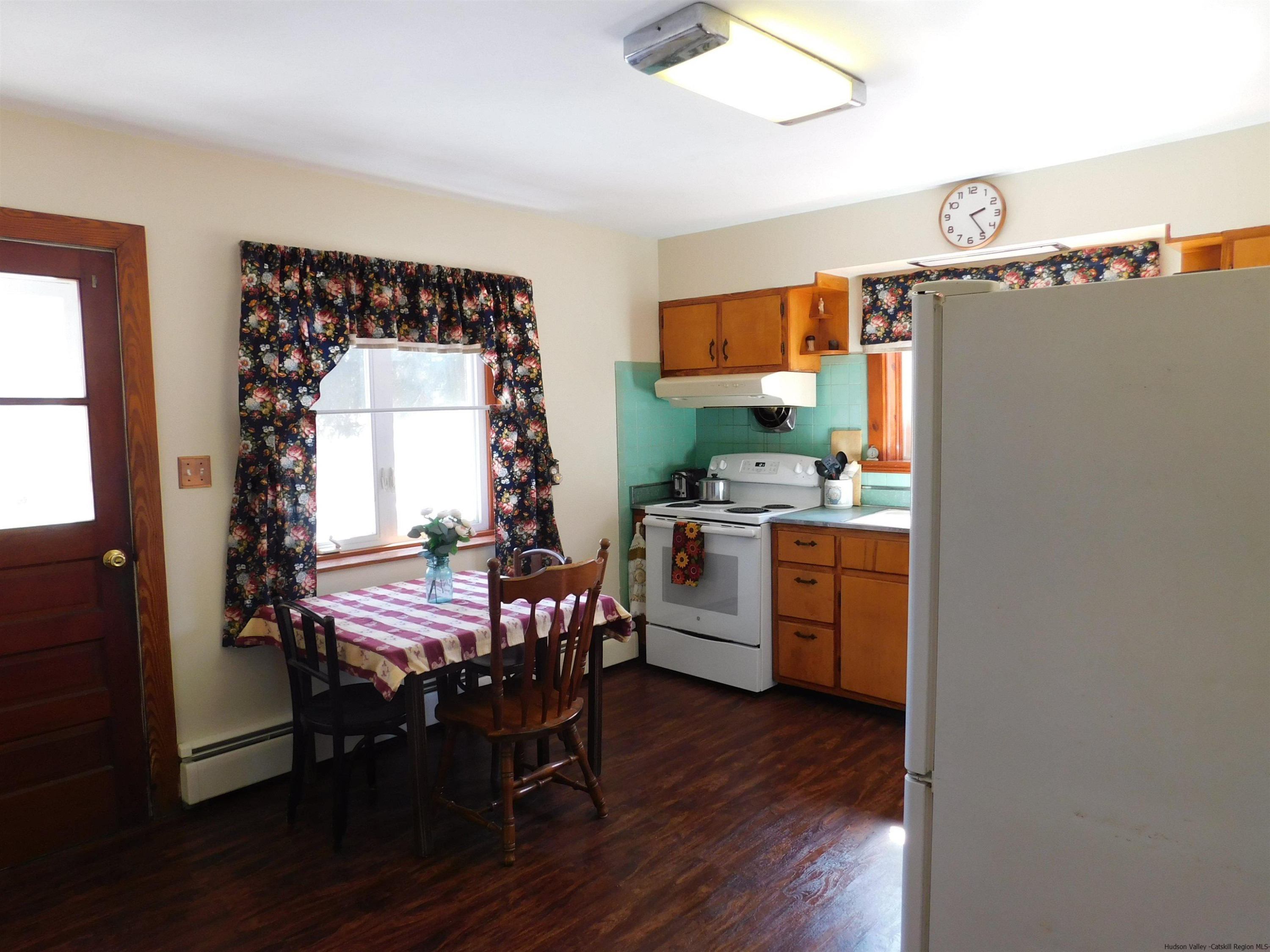 145 Sportsman Road Napanoch, NY 12458 - Photo 6 of 31 a kitchen with a wooden table and chairs