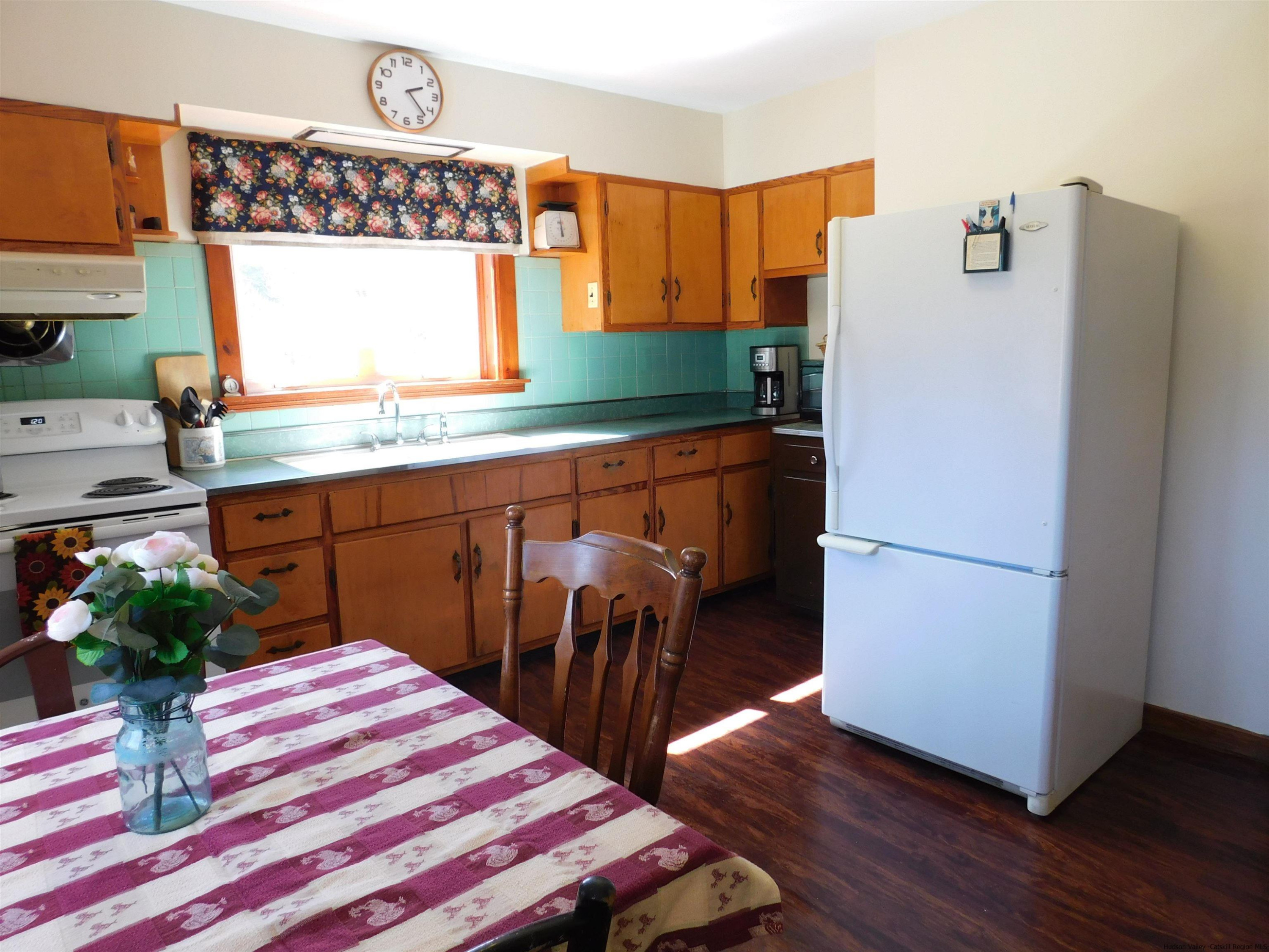 145 Sportsman Road Napanoch, NY 12458 - Photo 7 of 31 a kitchen with stainless steel appliances a refrigerator and a stove