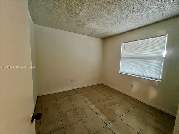 en empty room with windows