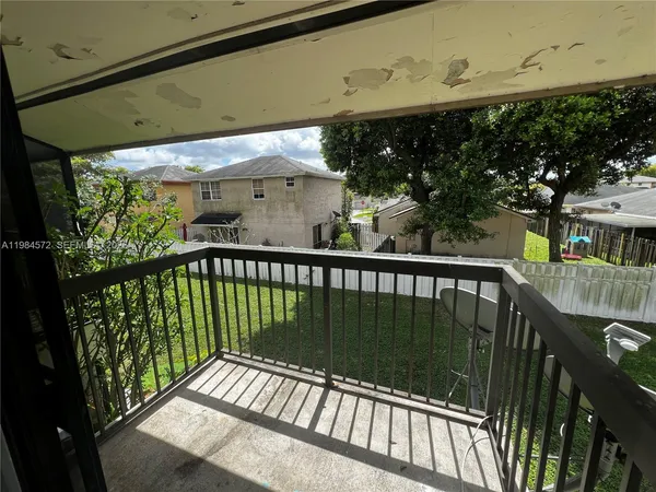 a view of a street from a balcony