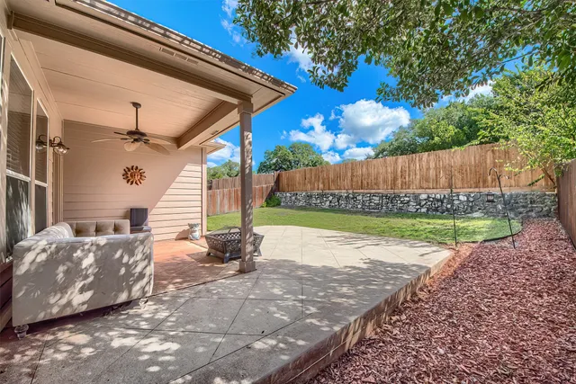 a view of a backyard with a tub