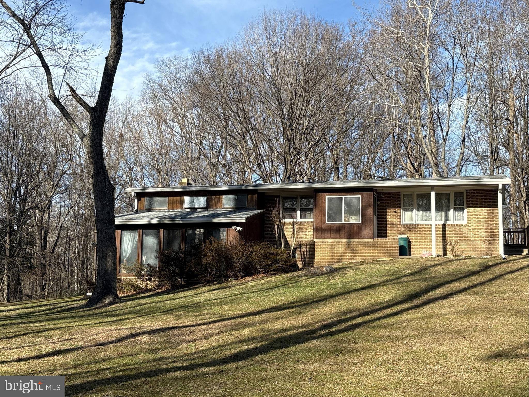 1662 Paris Oaks Road Owings, MD 20736 - Photo 1 of 2 a front view of a house with a yard