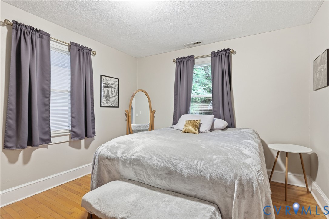 3510 East River Road Petersburg, VA 23803 - Photo 17 of 21 a bedroom with a bed and a large window