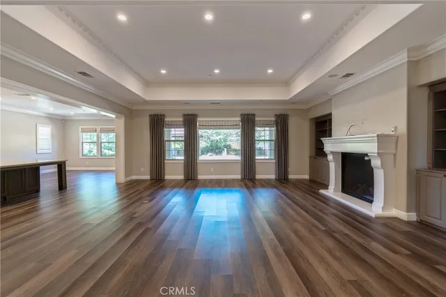 a kitchen with stainless steel appliances granite countertop a sink stove and wooden floor
