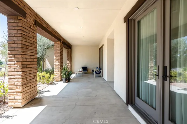 a backyard of a house with outdoor seating