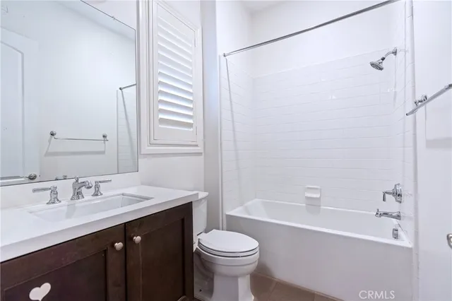 a view of a backyard of a house with wooden floor and outdoor seating