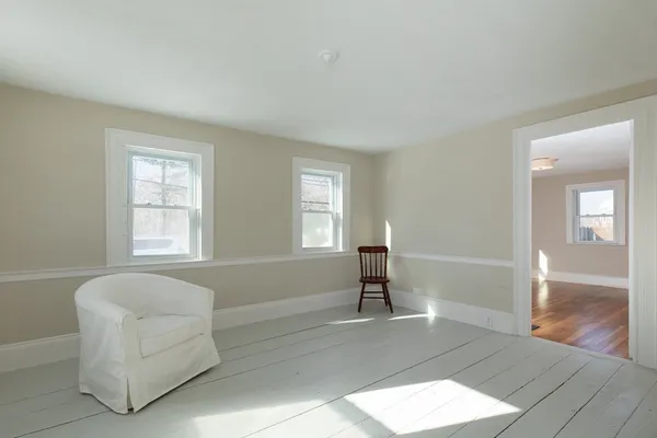 a living room with furniture and windows