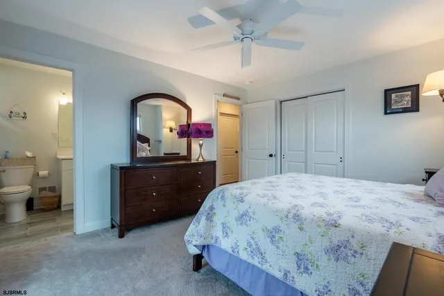 a bed room with a bed and a window