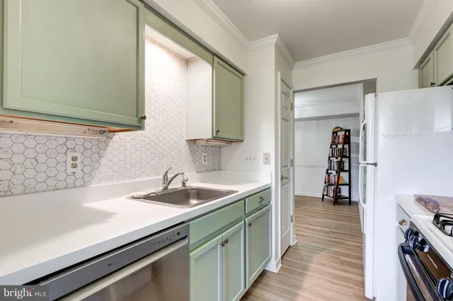 a kitchen with a sink and a refrigerator