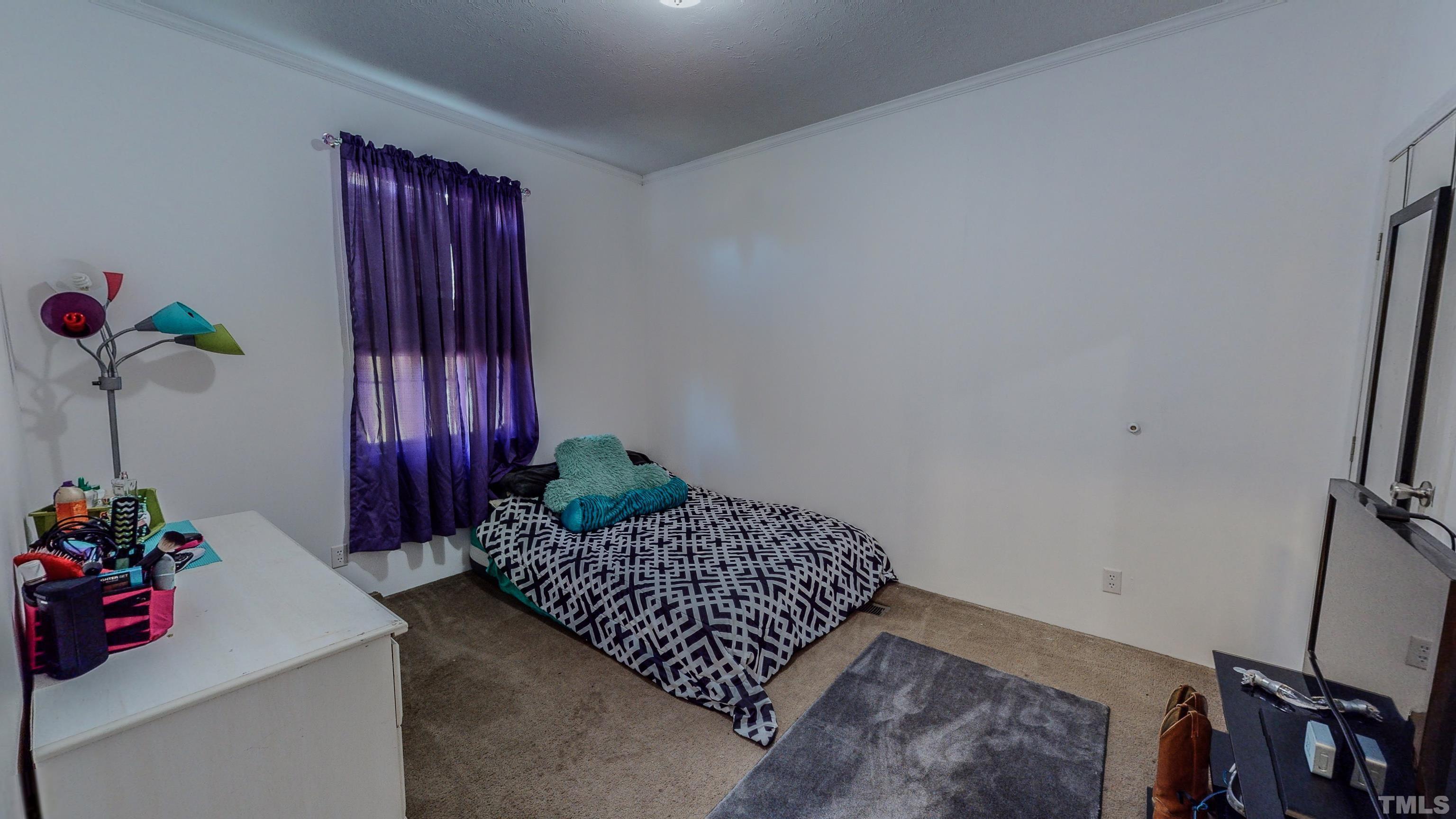 348 Wilbourne Run Roxboro, NC 27574 - Photo 22 of 25 a living room with furniture and flowers