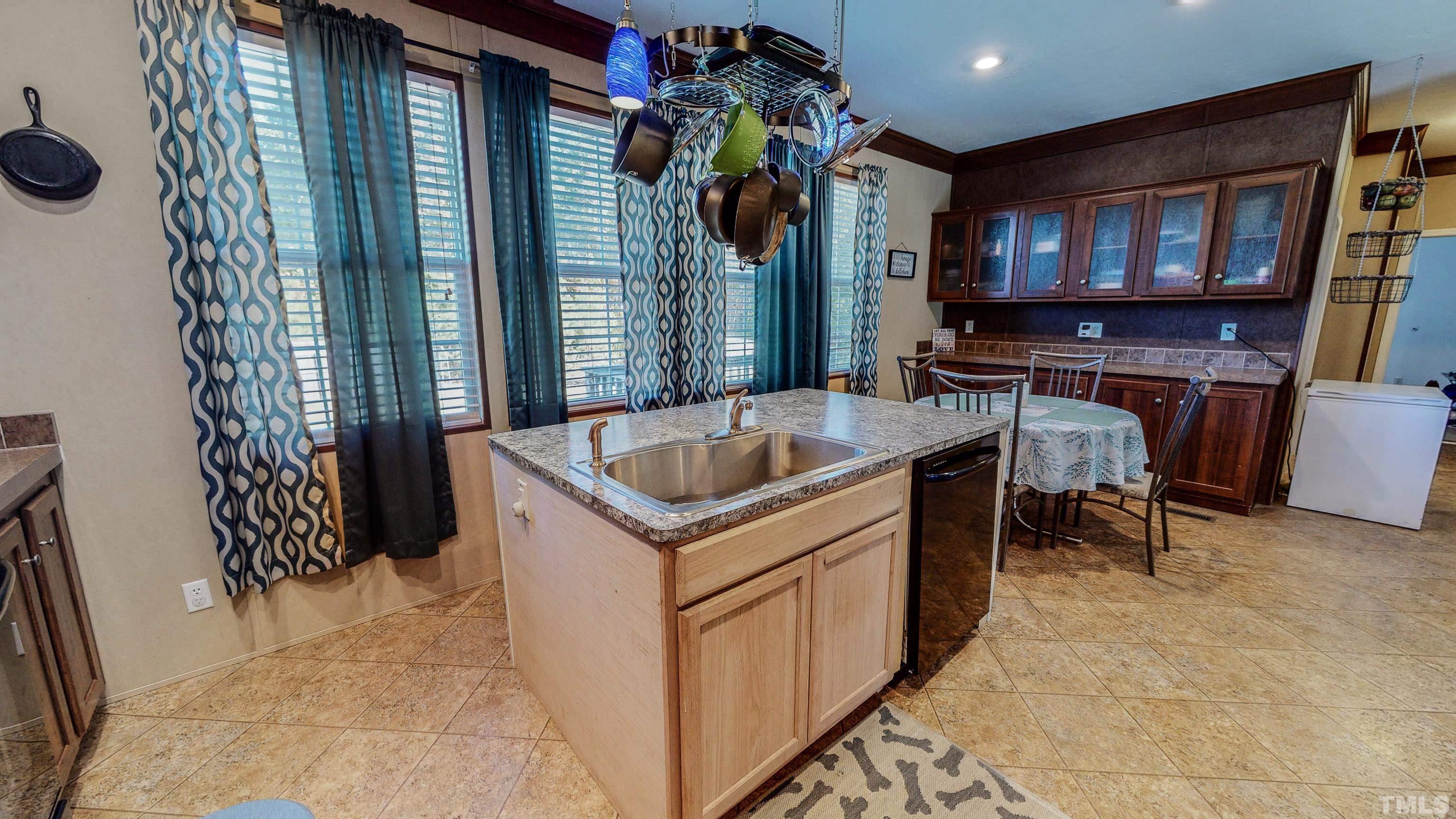 348 Wilbourne Run Roxboro, NC 27574 - Photo 7 of 25 a view of living room kitchen and entryway