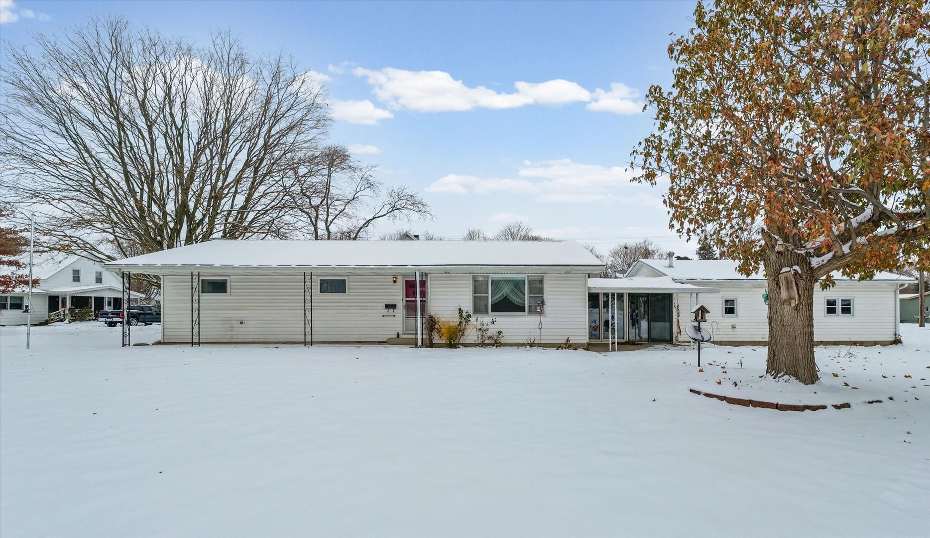 107 North Ellen Street Homer, IL 61849 - Photo 3 of 27 a view of a white house with a large tree