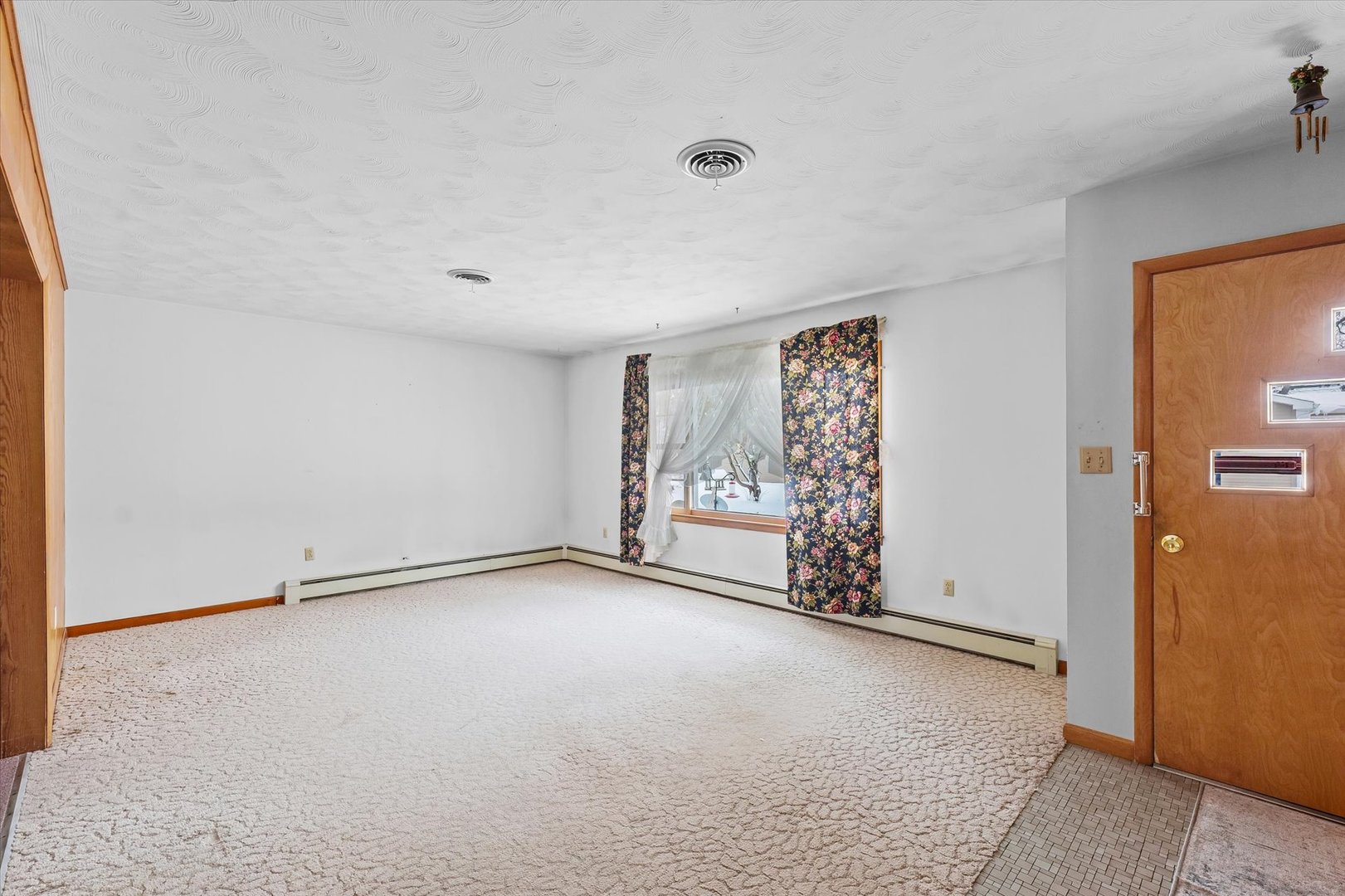 107 North Ellen Street Homer, IL 61849 - Photo 5 of 27 a view of an empty room with a window