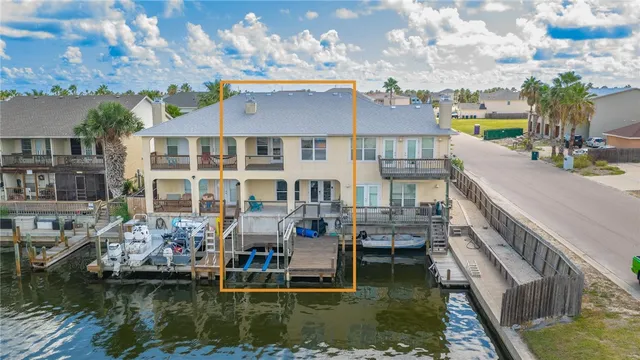 a view of houses with water fall and outdoor seating
