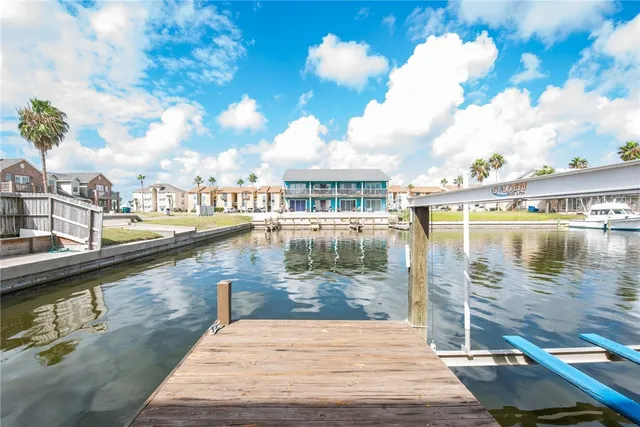 an aerial view of a house with a ocean view