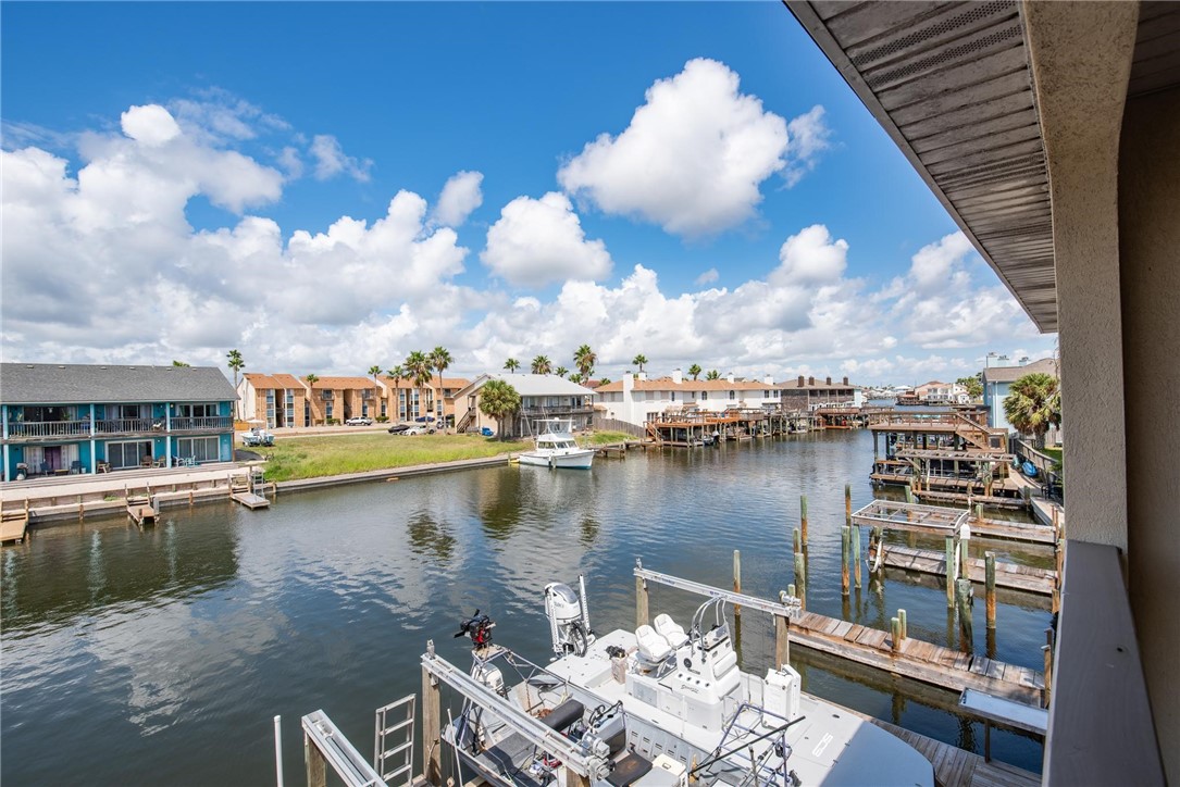 15417 Gun Cay Court, Unit B Corpus Christi, TX 78418 - Photo 4 of 35 a view of a lake with a terrace