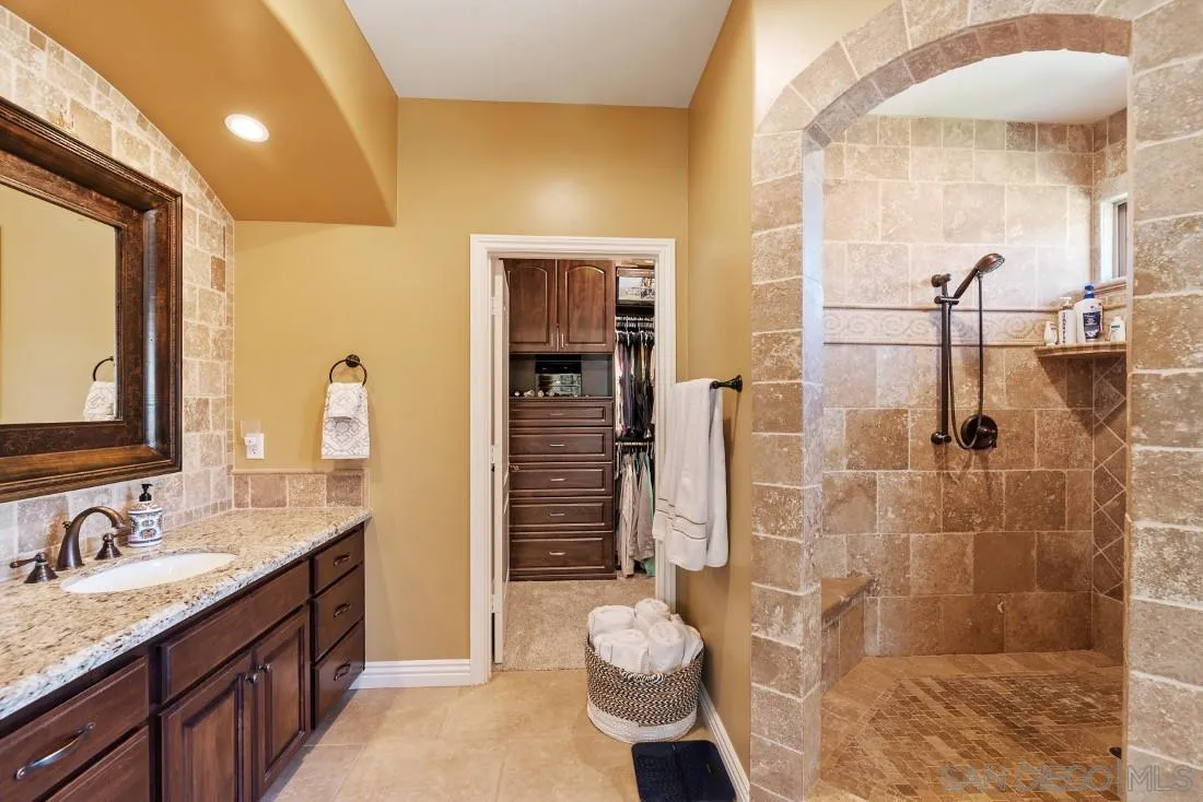 1070 Heritage Ranch Road Ramona, CA 92065 - Photo 35 of 73 a bathroom with a granite countertop sink toilet and shower