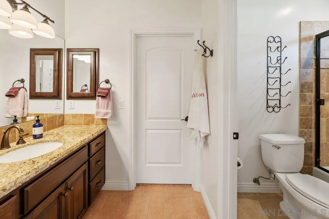 1070 Heritage Ranch Road Ramona, CA 92065 - Photo 41 of 73 a bathroom with a granite countertop sink toilet and shower