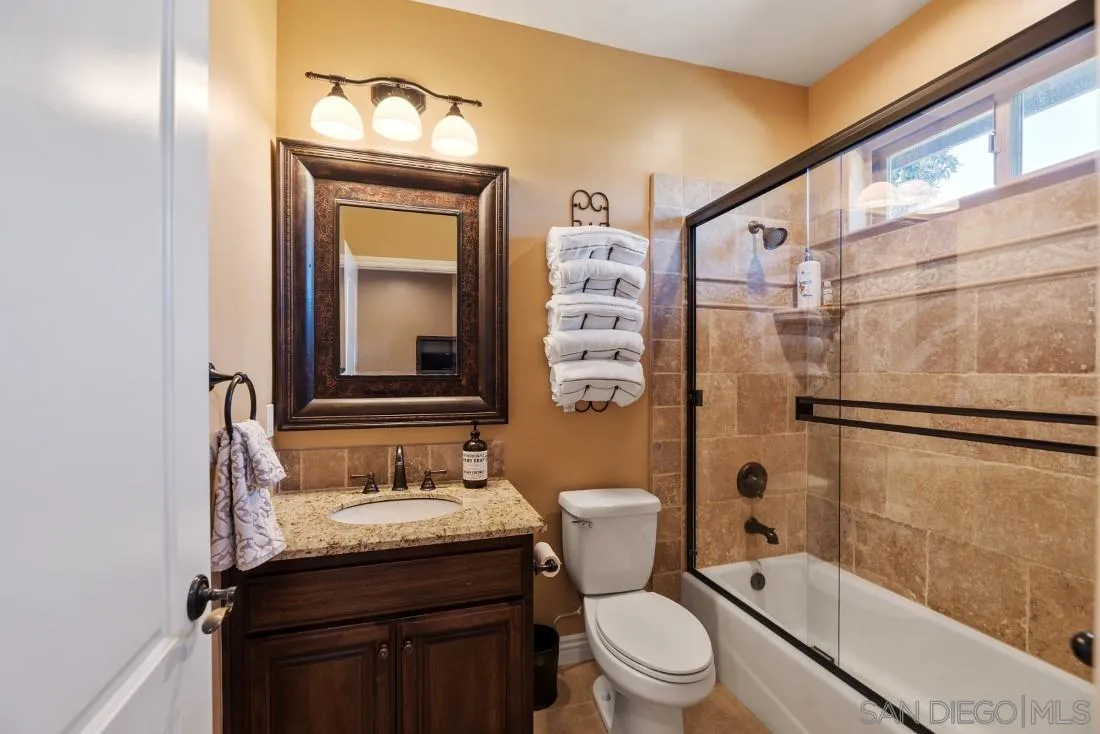 1070 Heritage Ranch Road Ramona, CA 92065 - Photo 44 of 73 a bathroom with a granite countertop sink toilet and shower