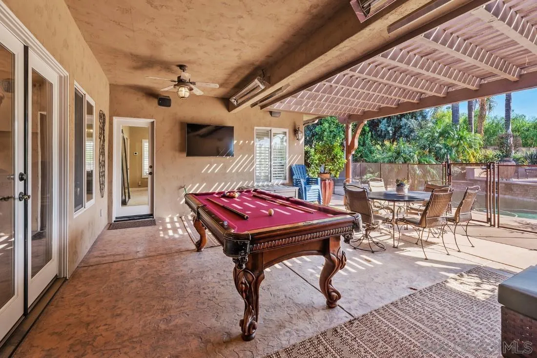 1070 Heritage Ranch Road Ramona, CA 92065 - Photo 48 of 73 a dining room with a wooden table and chairs
