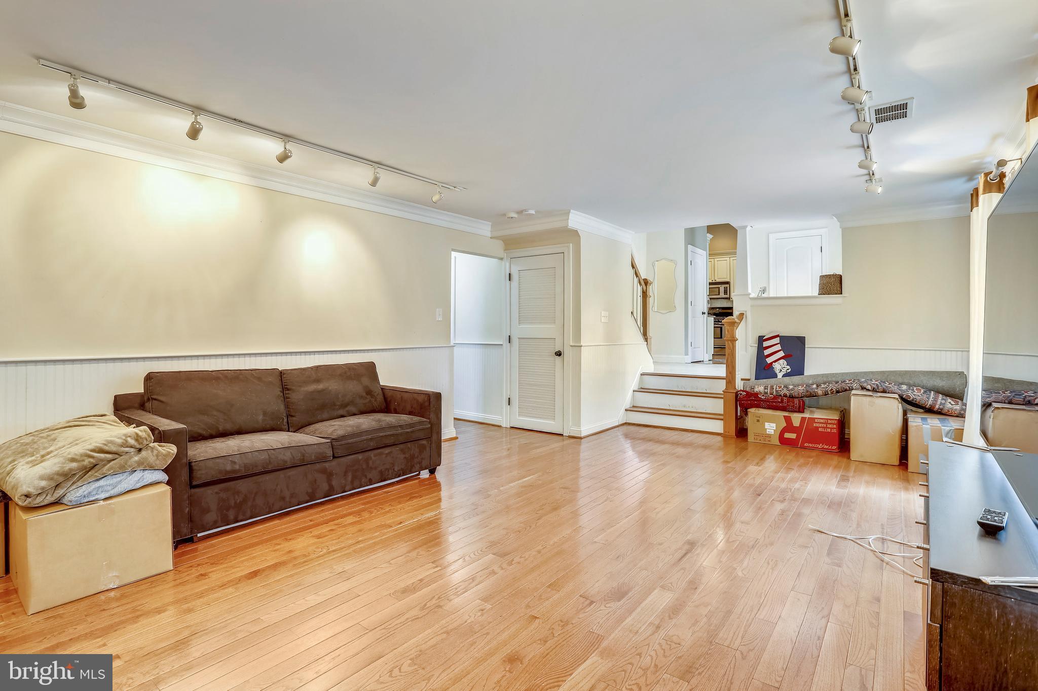 10145 Colebrook Avenue Potomac, MD 20854 - Photo 19 of 30 a living room with furniture and a wooden floor