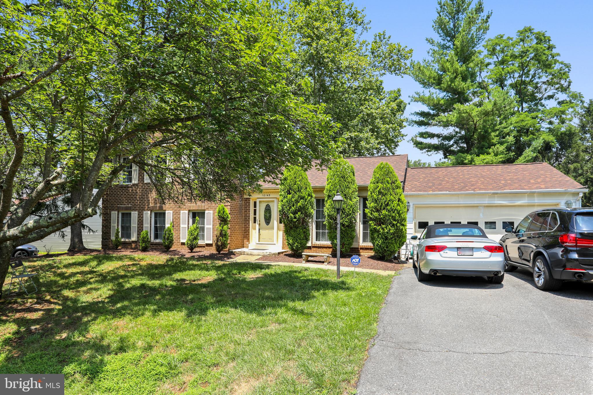 10145 Colebrook Avenue Potomac, MD 20854 - Photo 2 of 30 a front view of a building with garden