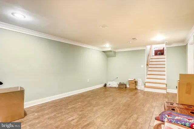 a view of a room with wooden floor and chair