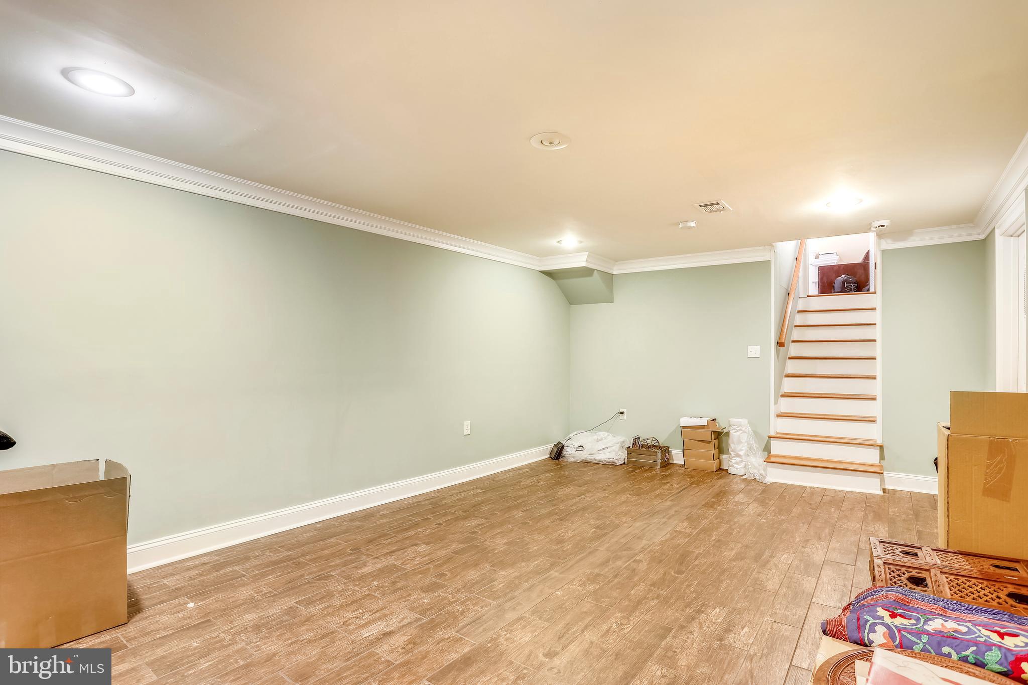 10145 Colebrook Avenue Potomac, MD 20854 - Photo 25 of 30 a view of a room with wooden floor and chair