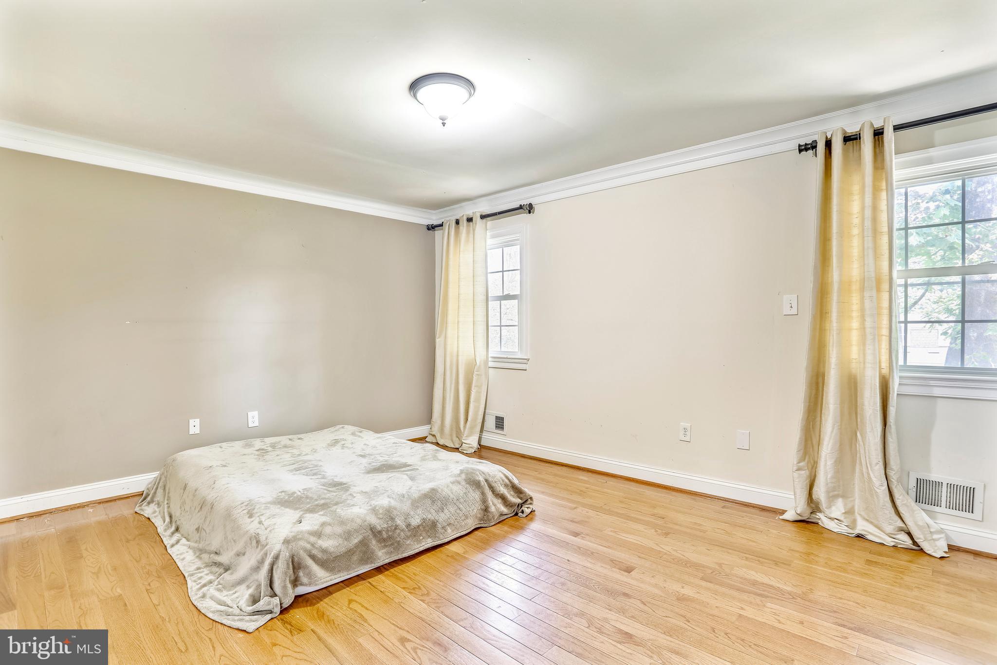 10145 Colebrook Avenue Potomac, MD 20854 - Photo 9 of 30 a bedroom with a bed and a window