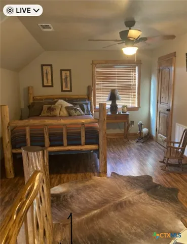 a bed room with a bed and a window