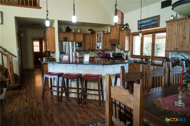 a view of a dining room with furniture and window