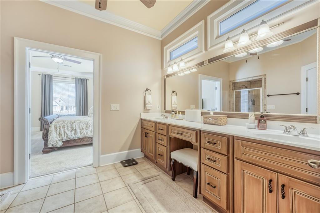 2380 Muskogee Lane Braselton, GA 30517 - Photo 26 of 30 a spacious bathroom with a double vanity sink a mirror and a