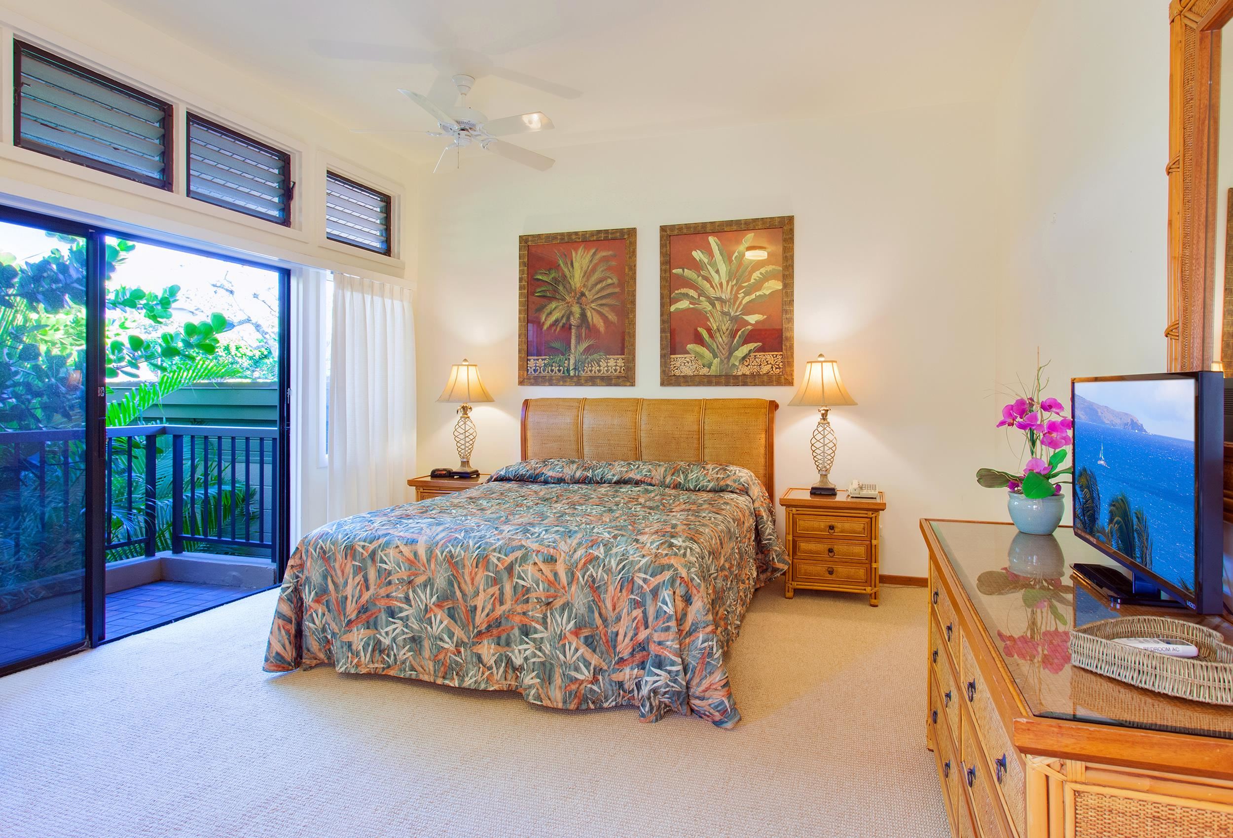 100 Ridge Road, Unit 321 Lahaina, HI 96761 - Photo 13 of 30 a bedroom with a bed and a flat tv screen