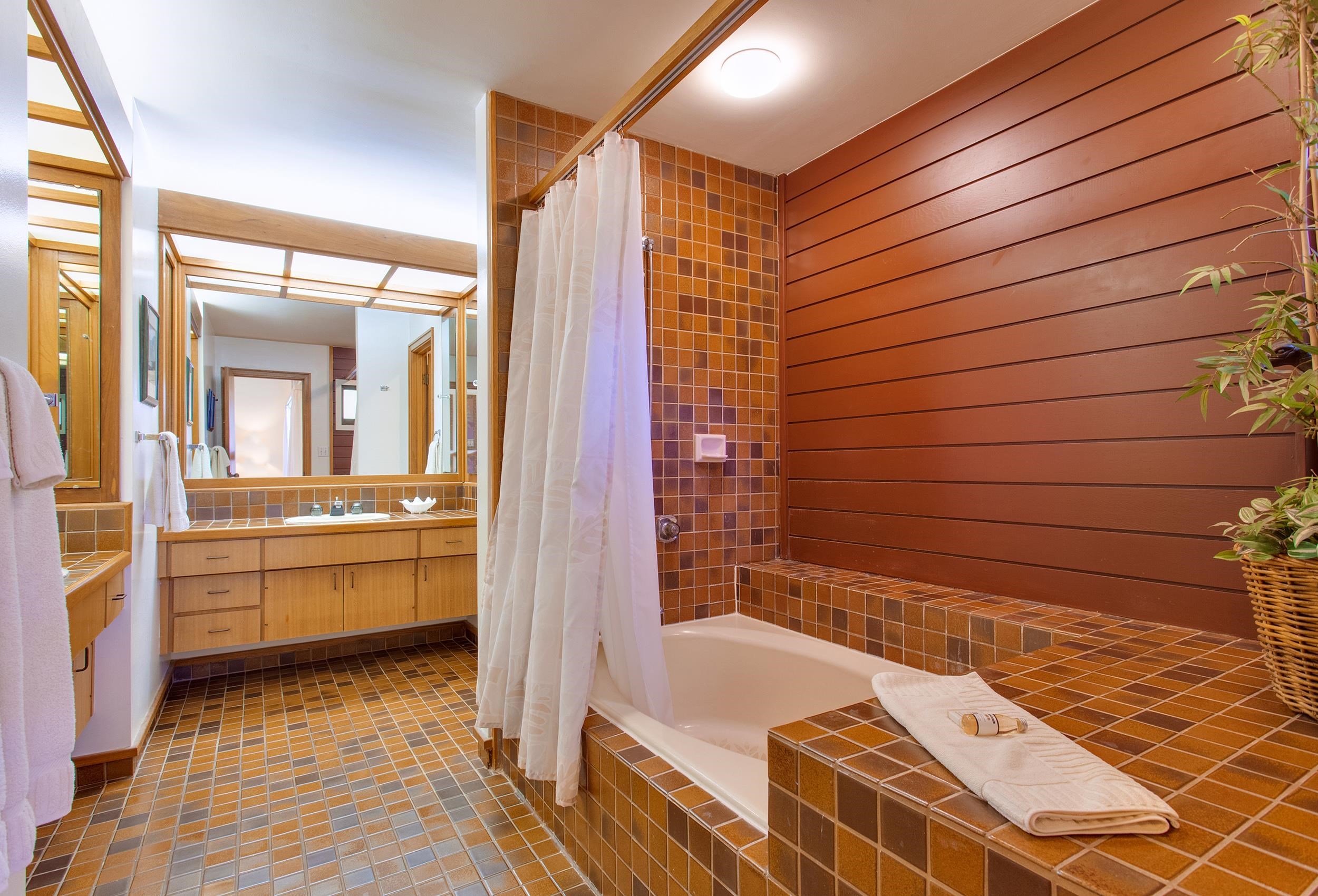100 Ridge Road, Unit 321 Lahaina, HI 96761 - Photo 14 of 30 a bathroom with a bathtub and shower