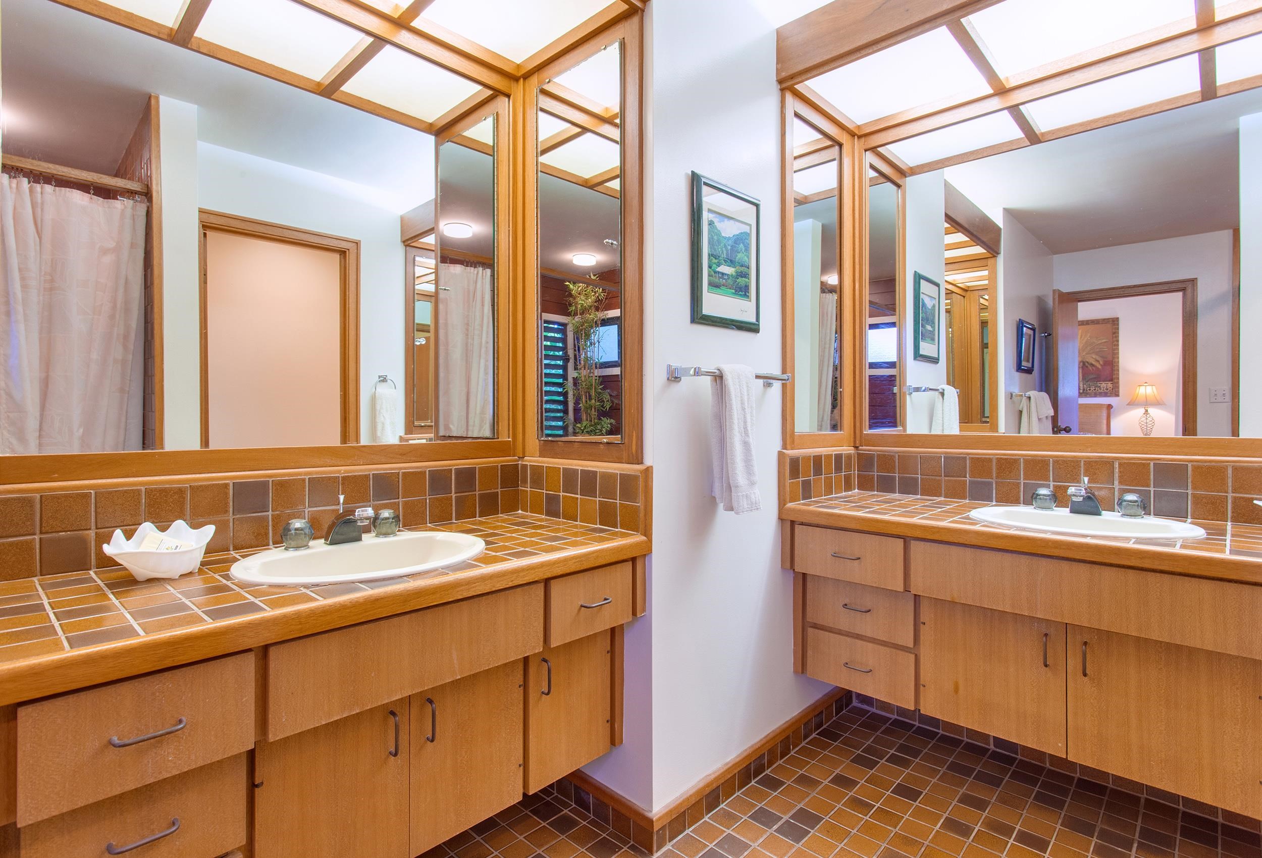 100 Ridge Road, Unit 321 Lahaina, HI 96761 - Photo 15 of 30 a bathroom with a double vanity sink and a mirror